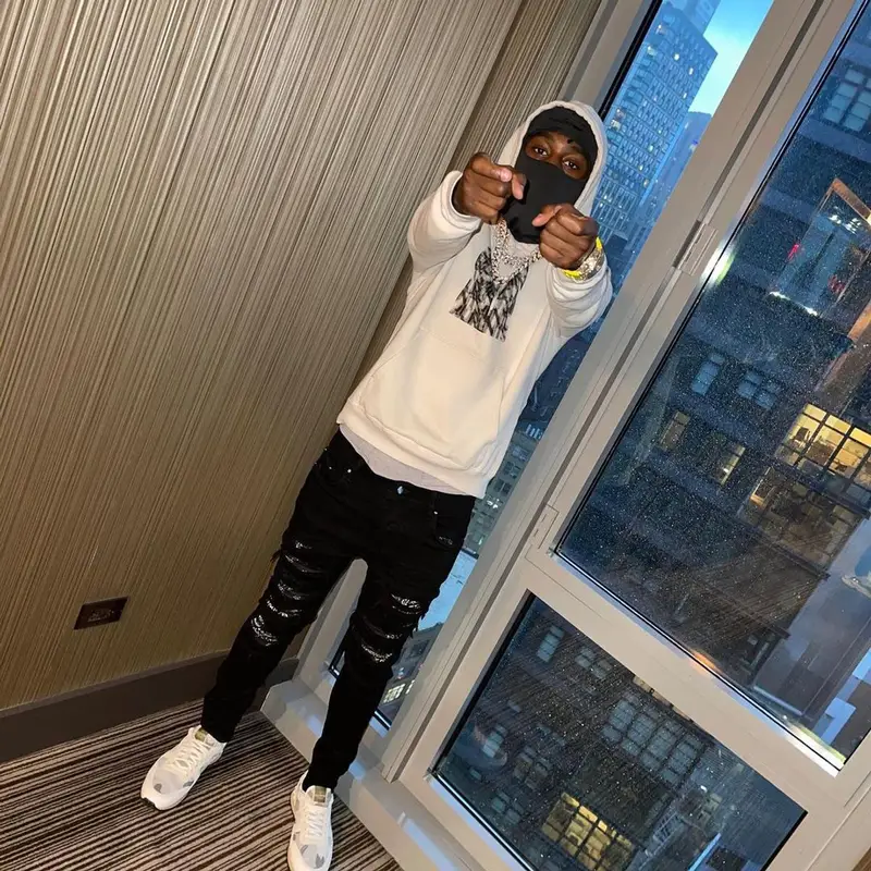 Lil Tjay outfit in Saint Laurent, Amiri, and Valentino, 2021