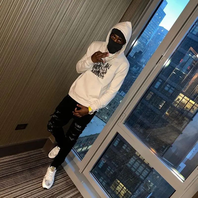 Lil Tjay outfit in Saint Laurent, Amiri, and Valentino, 2021