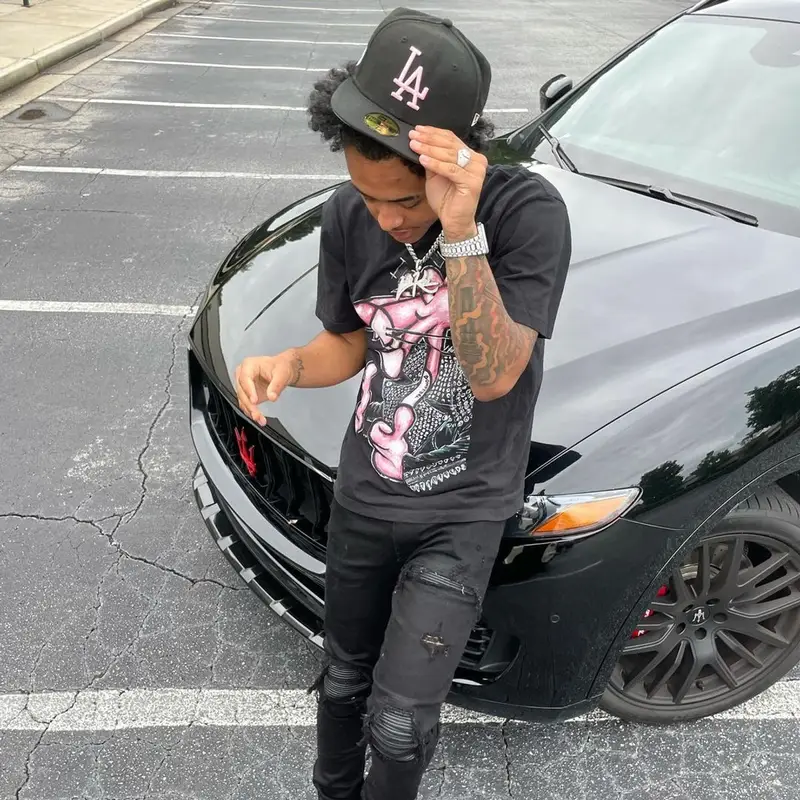 Luh Kel outfit in Amiri, Alexander McQueen, and New Era, 2021