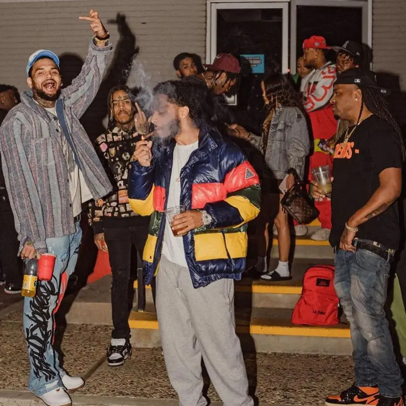 Chris Brown outfit in Cosey X Cosey, Nike, and Travis Scott Merch, 2021