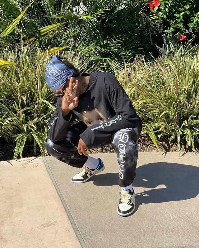 Nick Young outfit in Kanye West Merch, Nike, and Louis Vuitton, 2021