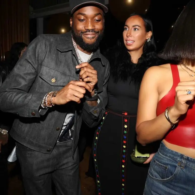 Meek Mill outfit in Louis Vuitton, Nike, and New Era, 2021