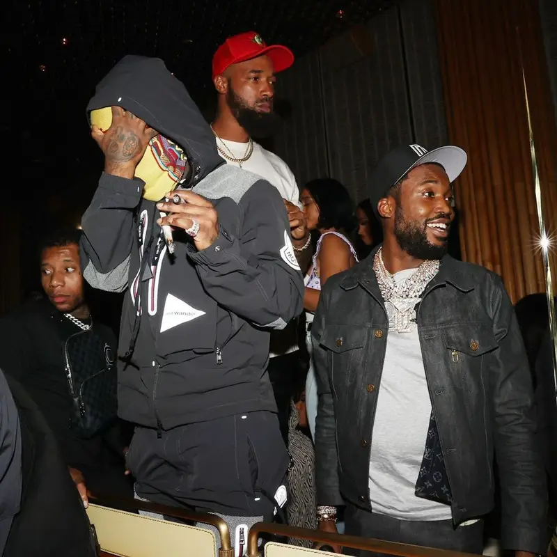 Meek Mill outfit in Louis Vuitton, Nike, and New Era, 2021