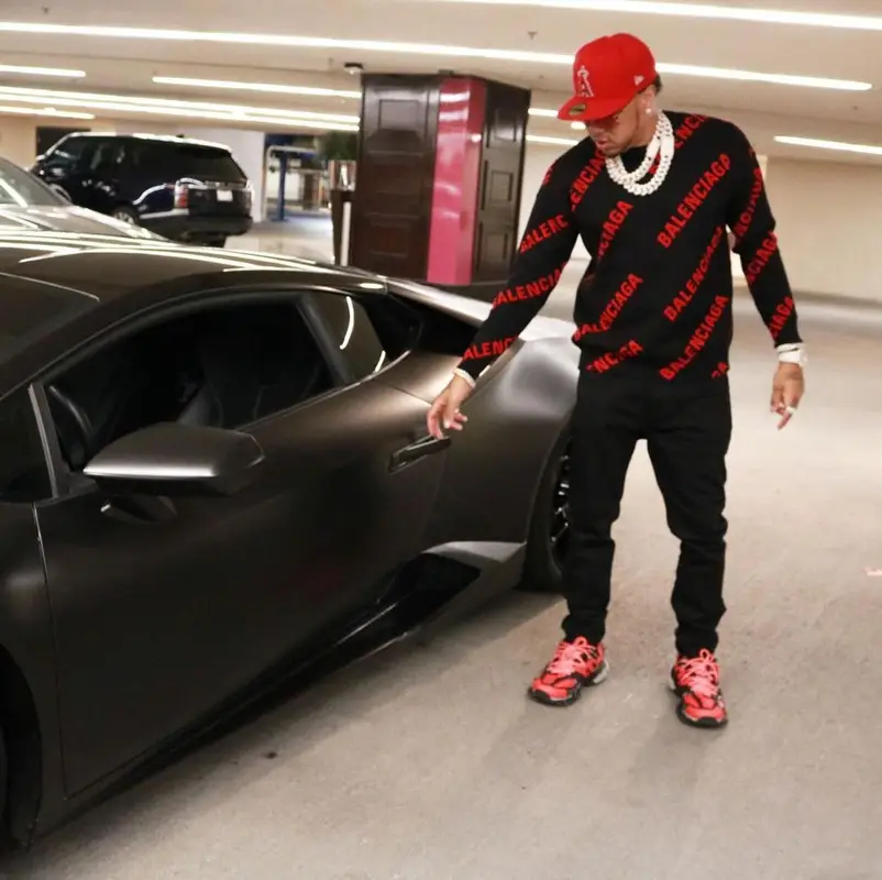 Mazi Vs outfit in Balenciaga, Cartier, and New Era, 2021