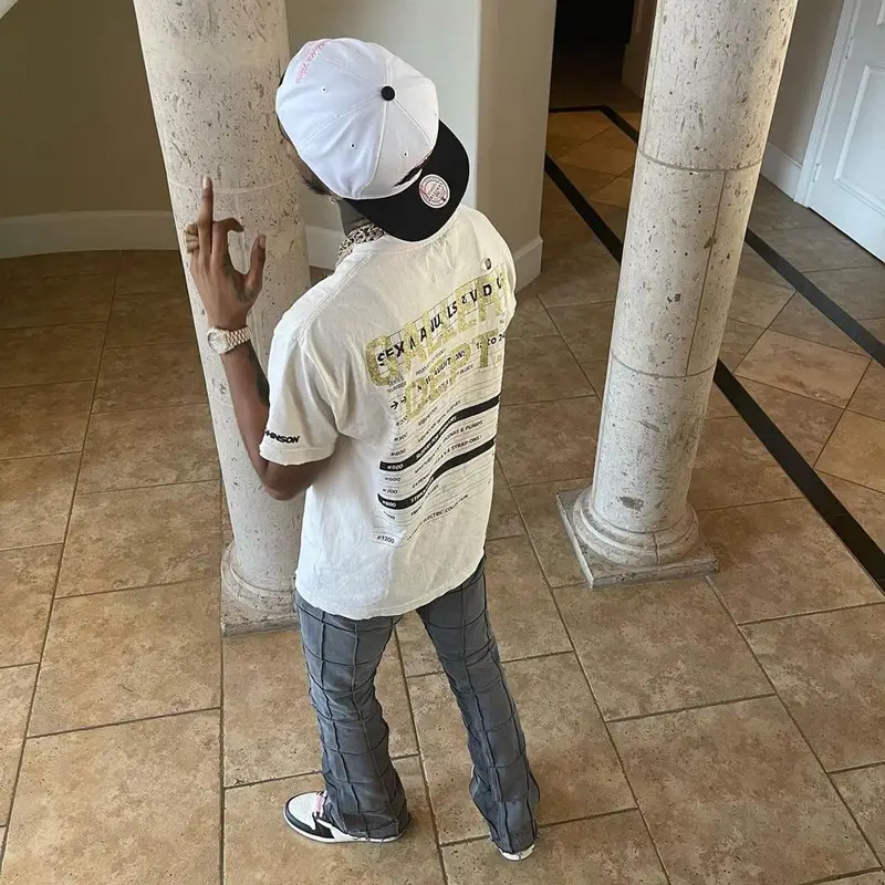 Key Glock outfit in Gallery Dept., Nike, and Travis Scott Merch, 2021