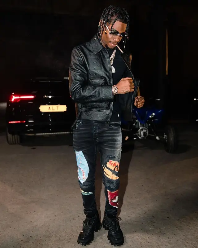 Russ Millions outfit in Louis Vuitton, Polo Ralph Lauren, and Amiri, 2021