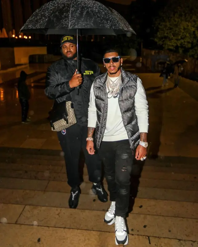 CJ outfit in Dior, Amiri, and Louis Vuitton, 2021