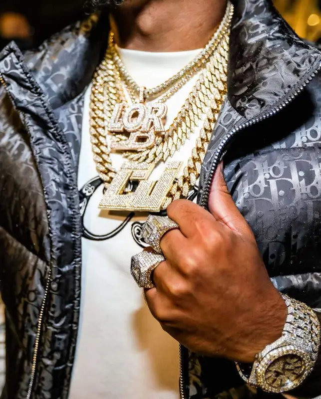CJ outfit in Dior, Amiri, and Louis Vuitton, 2021