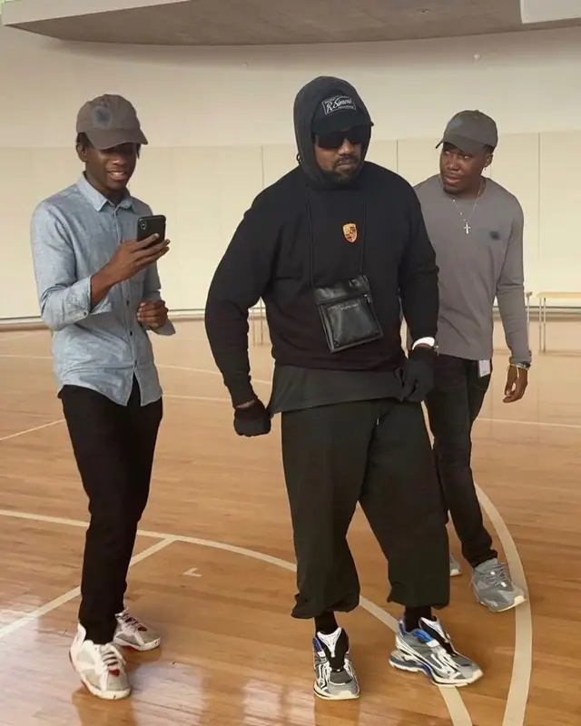 Kanye West outfit in Porsche Design, Balenciaga, and Raf Simons, 2021