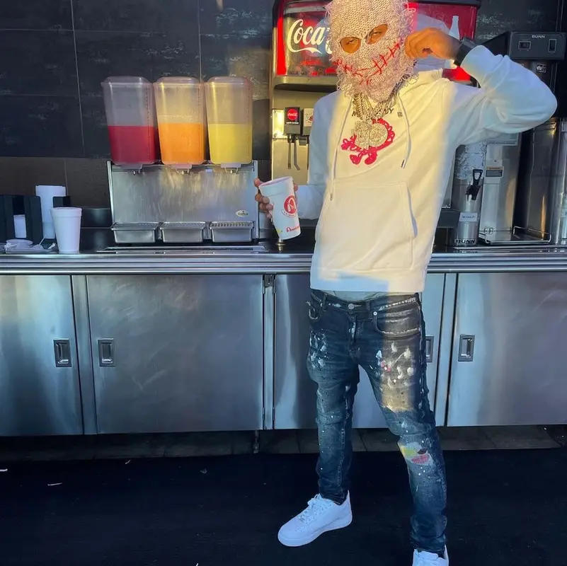 Rich The Kid outfit in Purple Brand, Nike, and Greedy Unit, 2021