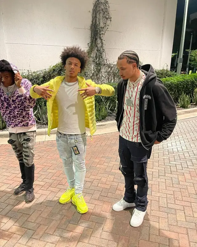 Mikey outfit in Stone Island, Amiri, and MCM, 2021