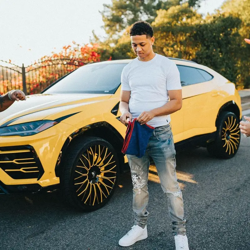 Lil Bibby outfit in Gallery Dept., Polo Ralph Lauren, and Amiri, 2021