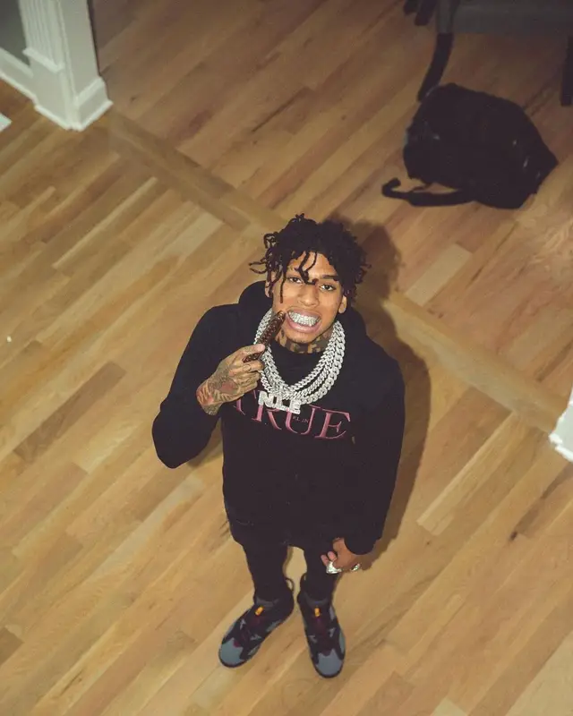 NLE Choppa outfit in True Religion, Dolce & Gabbana, and Jordan, 2021