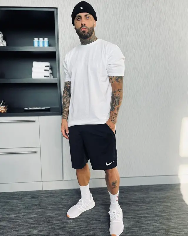 Nicky Jam outfit in Hanes, Nike, and Obey, 2021