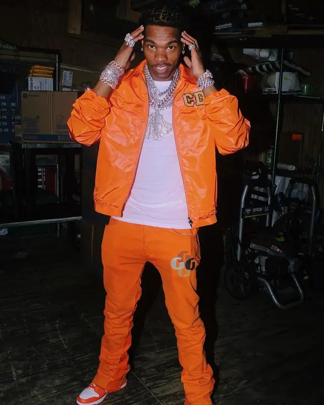 Lil Baby outfit in Dior, Nike, and Kenny Scharf, 2021