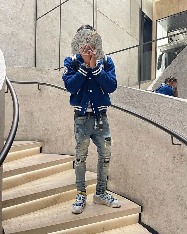 Lil Migo outfit in Diamond Supply Co., Taylor Gang, and Weedmaps, 2021