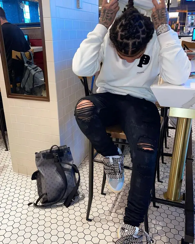 Young M.A outfit in Purple Brand, Lanvin, and Louis Vuitton, 2021