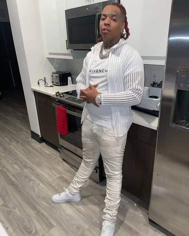 Lil Gotit outfit in Givenchy, Purple Brand, and Nike, 2021