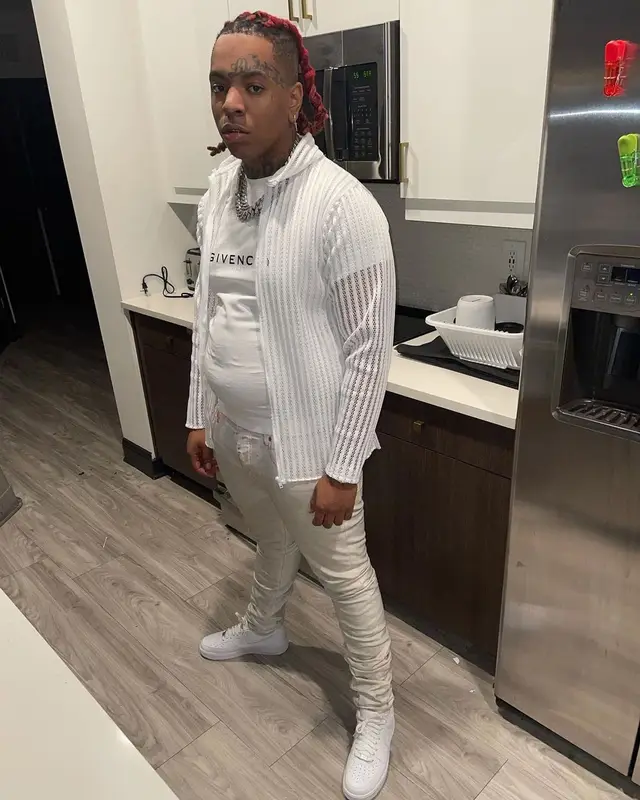Lil Gotit outfit in Givenchy, Purple Brand, and Nike, 2021
