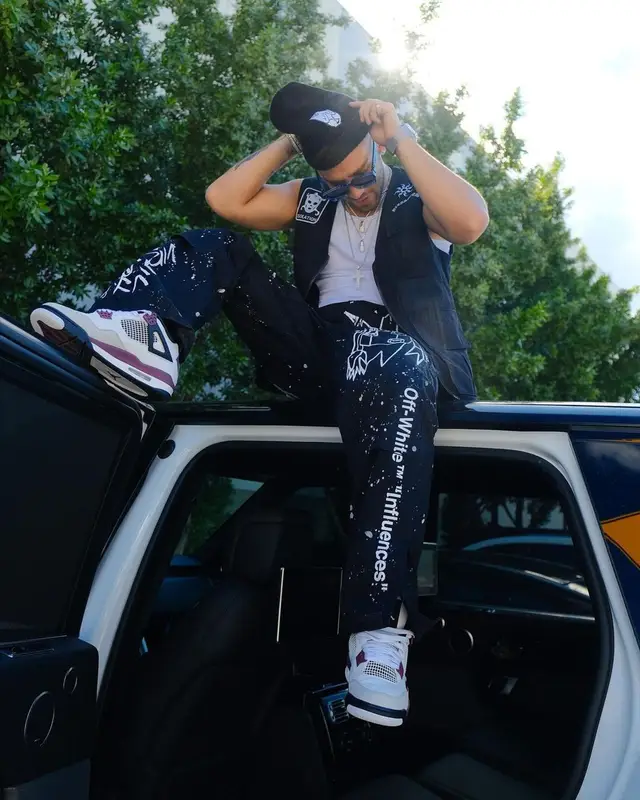 Manuel Turizo outfit in Pleasures, Louis Vuitton, and Ripndip, 2021