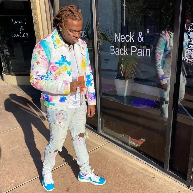 Gunna outfit in Louis Vuitton, Purple Brand, and Cartier, 2021