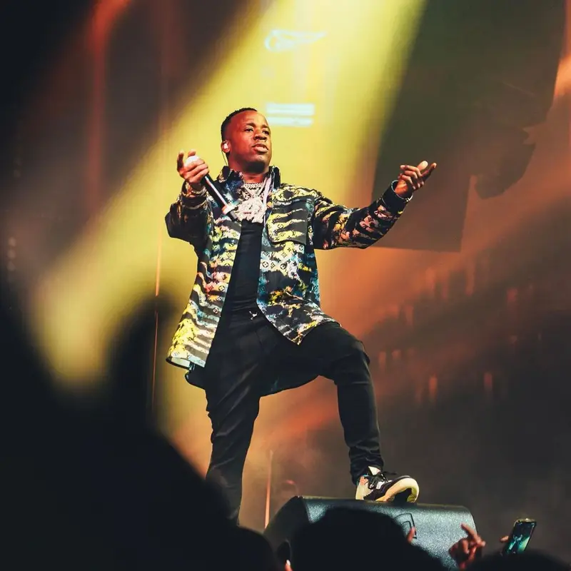Yo Gotti outfit in Louis Vuitton, Amiri, and Jordan, 2021