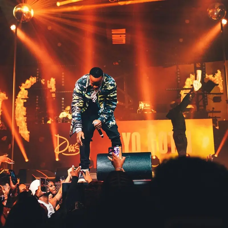 Yo Gotti outfit in Louis Vuitton, Amiri, and Jordan, 2021