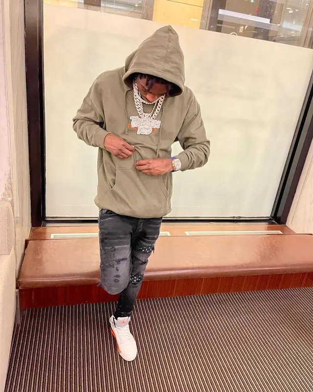 Lil Tjay outfit in Anti Social Social Club, Amiri, and Playboy, 2021