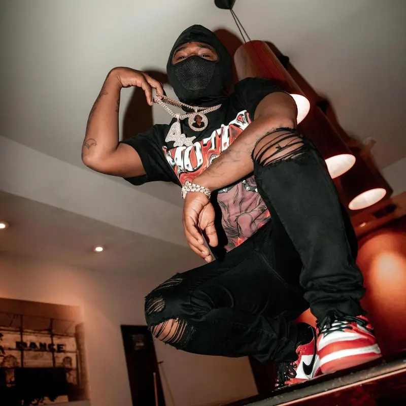 Mozzy outfit in Mozzy Merch, Amiri, and Nike, 2021