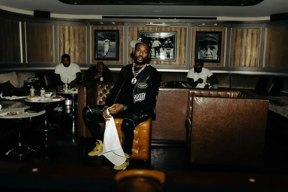 Meek Mill outfit in Supreme, Amiri, and New Era, 2021