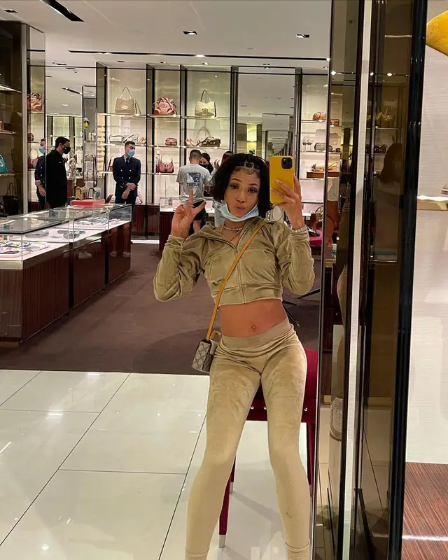 Coi Leray outfit in Skims, Nike, and Gucci, 2021