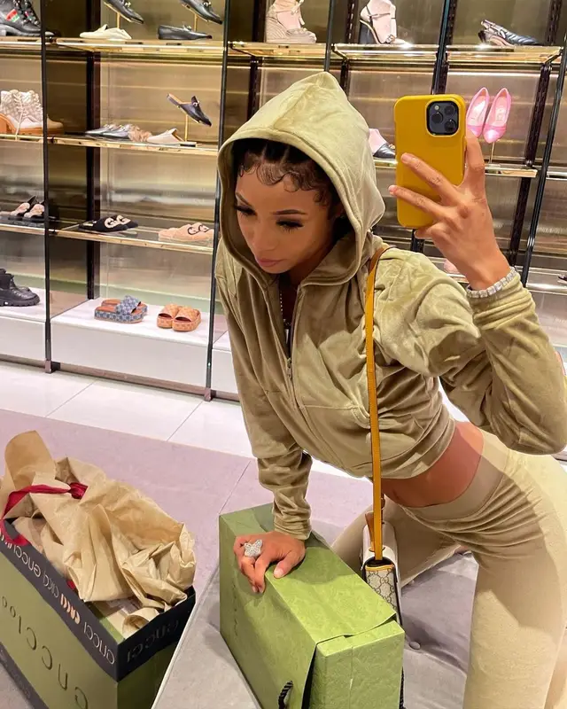 Coi Leray outfit in Skims, Nike, and Gucci, 2021