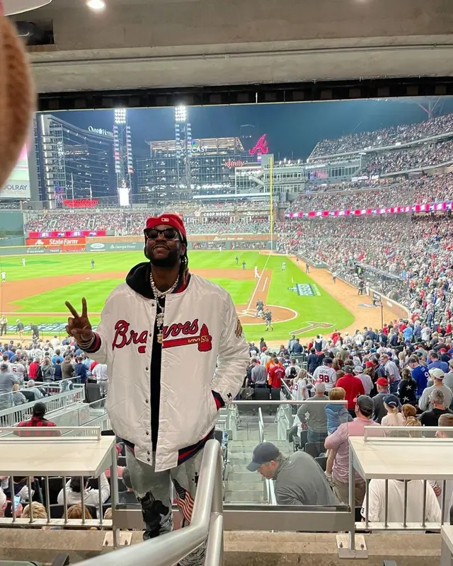 2 Chainz outfit in Starter, Bottega Veneta, and New Era, 2021