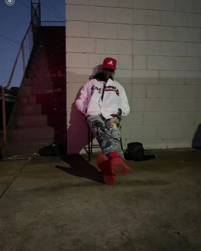 2 Chainz outfit in Starter, Bottega Veneta, and New Era, 2021