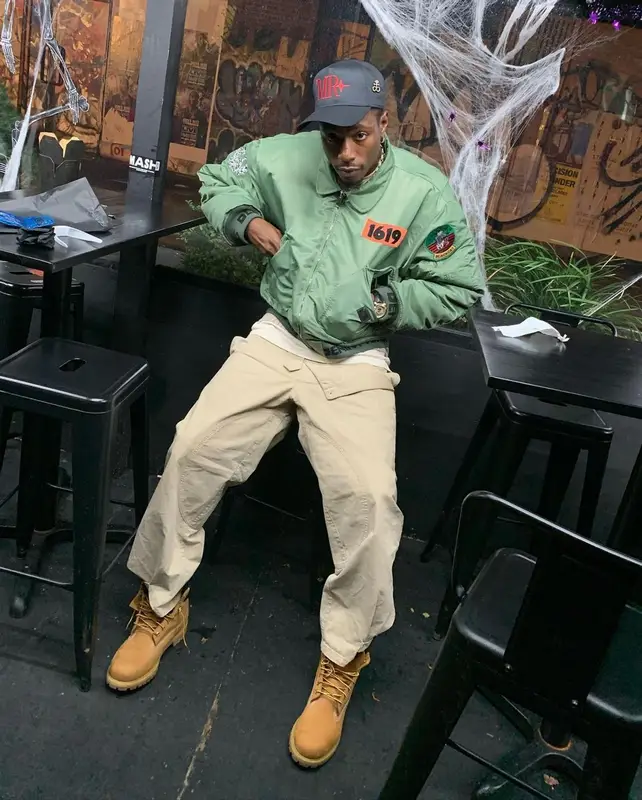 Joey Badass outfit in Denim Tears, JW Anderson, and Timberland, 2021