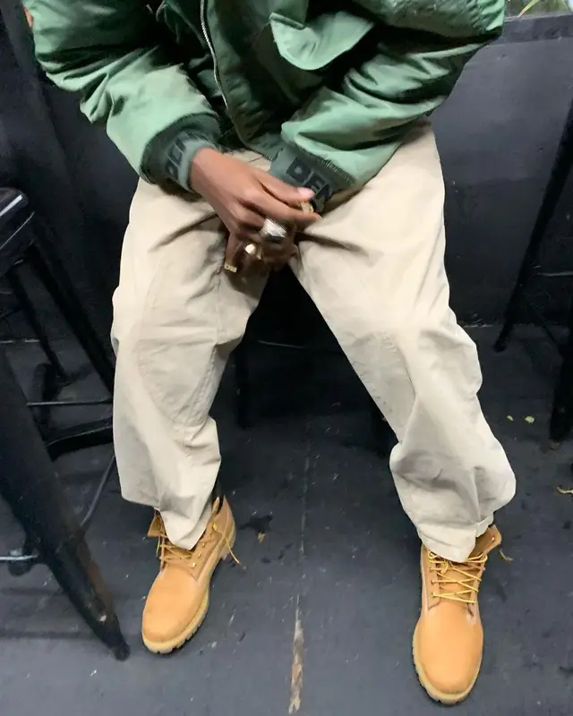 Joey Badass outfit in Denim Tears, JW Anderson, and Timberland, 2021