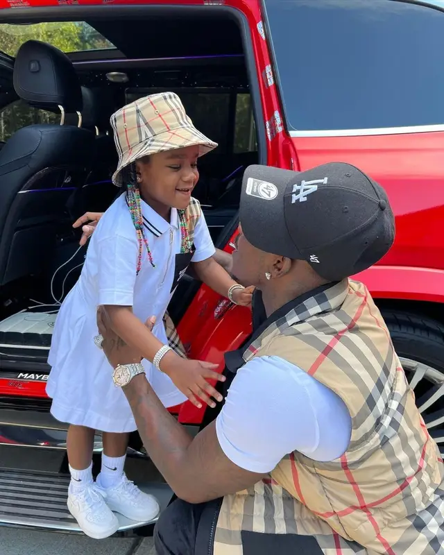 DaBaby outfit in Burberry, Hanes, and New Era, 2021