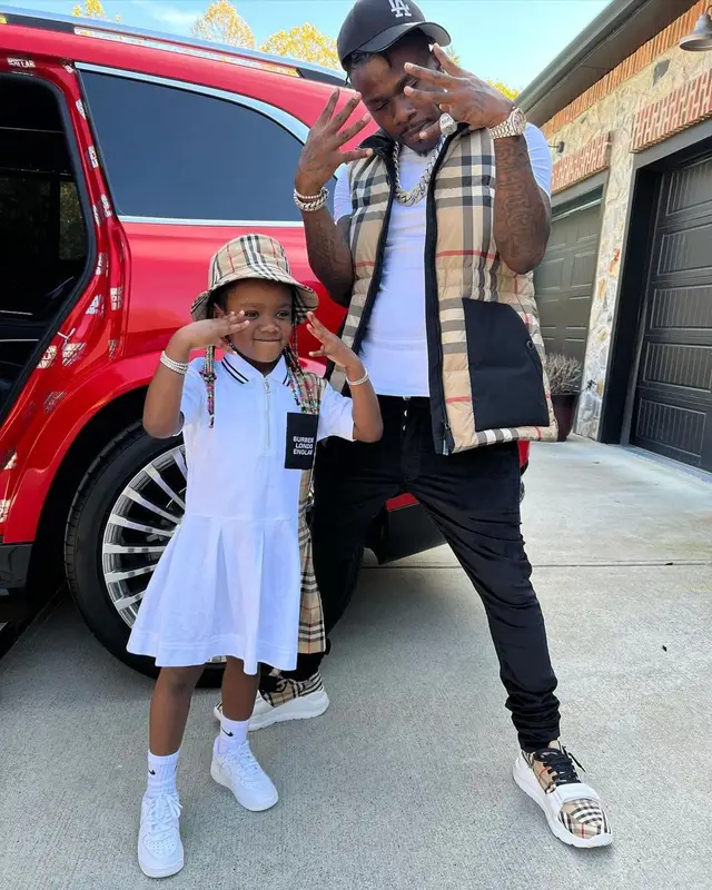 DaBaby outfit in Burberry, Hanes, and New Era, 2021