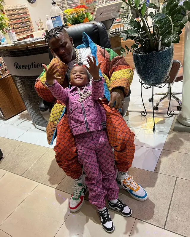 DaBaby outfit in Gucci, Bape, and Burberry, 2021