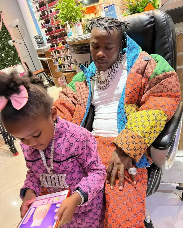 DaBaby outfit in Gucci, Bape, and Burberry, 2021