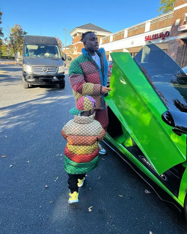 DaBaby outfit in Gucci, Bape, and Burberry, 2021