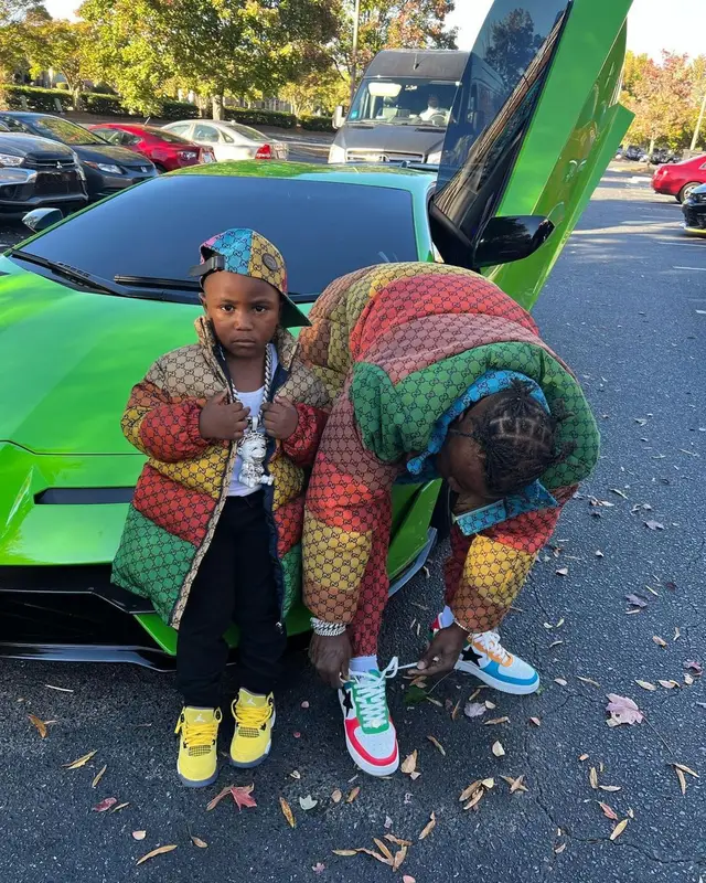 DaBaby outfit in Gucci, Bape, and Burberry, 2021