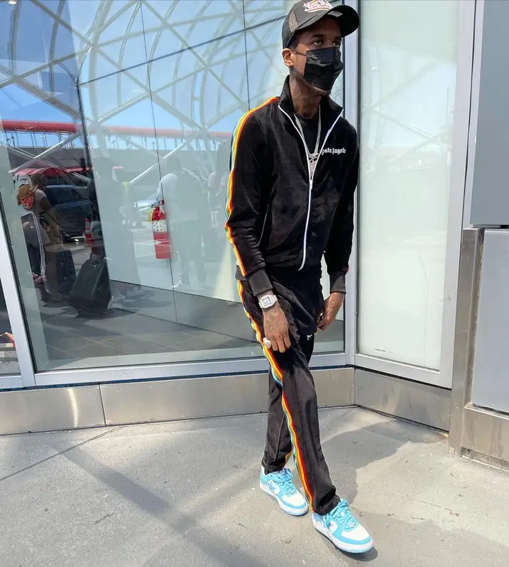 Lil Reese outfit in Palm Angels, Bape, and Von Dutch, 2021