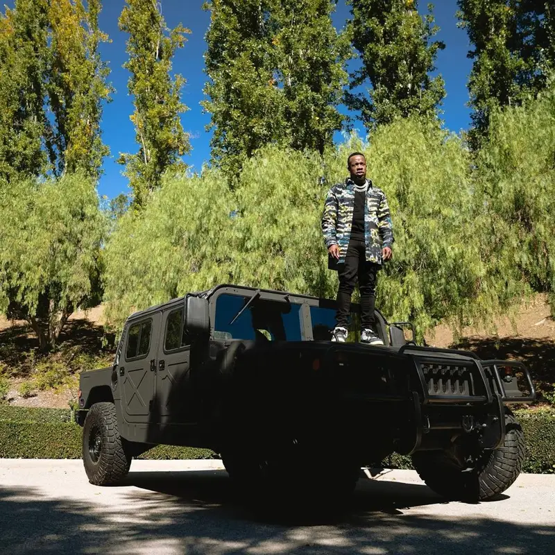 Yo Gotti outfit in Louis Vuitton, Amiri, and Jordan, 2021