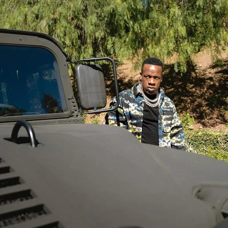 Yo Gotti outfit in Louis Vuitton, Amiri, and Jordan, 2021