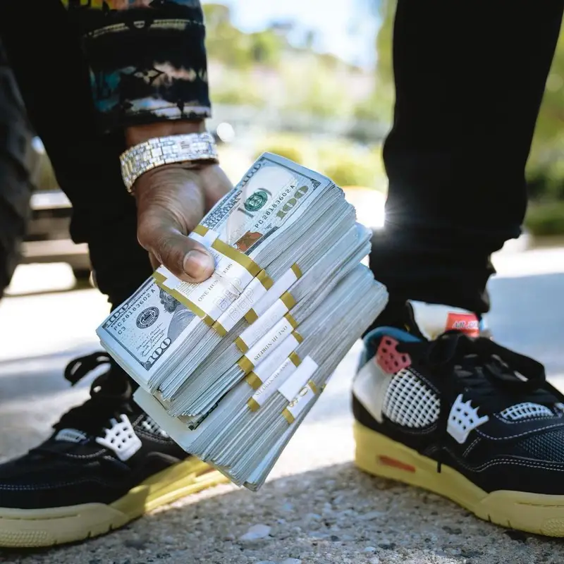 Yo Gotti outfit in Louis Vuitton, Amiri, and Jordan, 2021