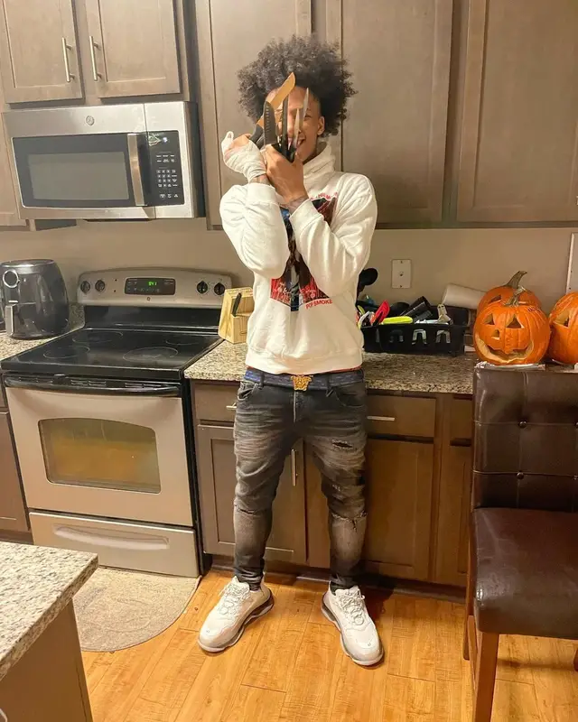 Mikey outfit in Vlone, Versace, and Pop Smoke Merch, 2021