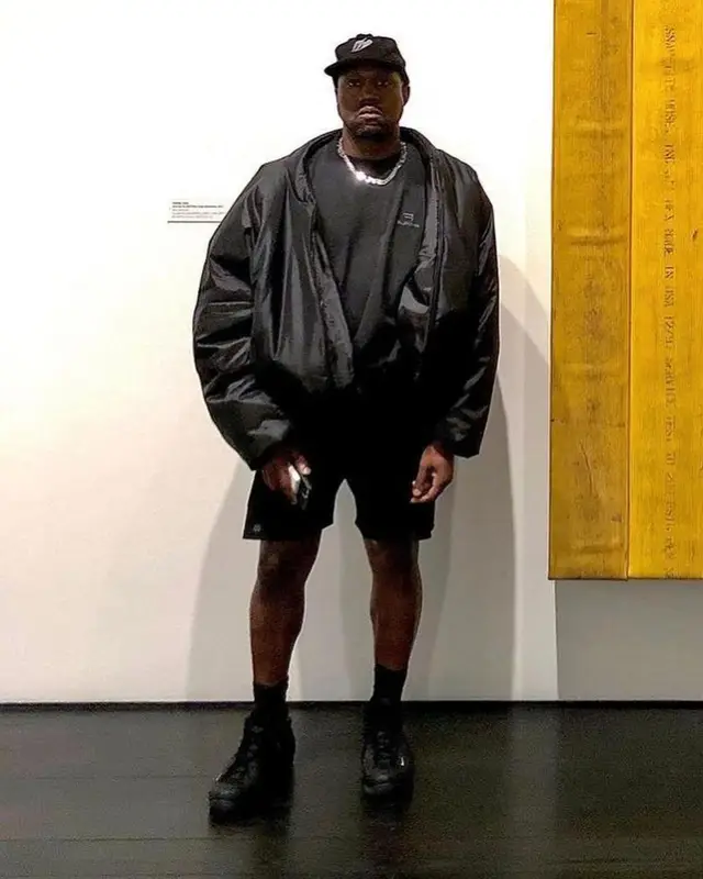 Kanye West outfit in Yeezy, Balenciaga, and GAP, 2021
