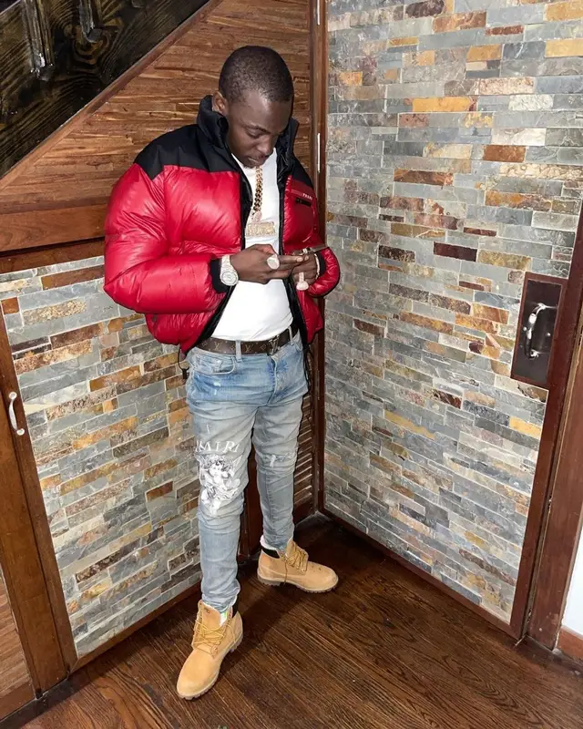 Bobby Shmurda outfit in Prada, Amiri, and Louis Vuitton, 2021