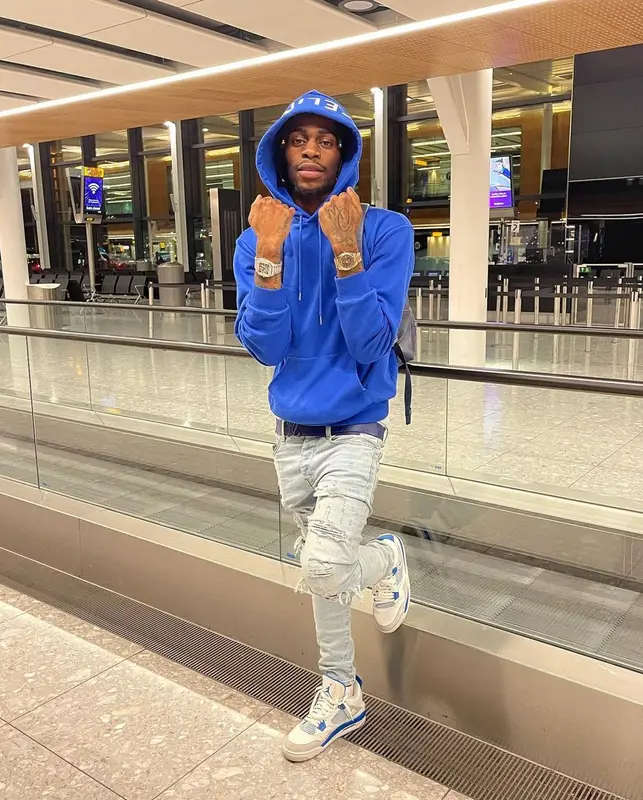Russ Millions outfit in Celine, Amiri, and Louis Vuitton, 2021